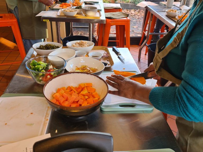 Cutting up vegetables as part of a project promoting healthy eating