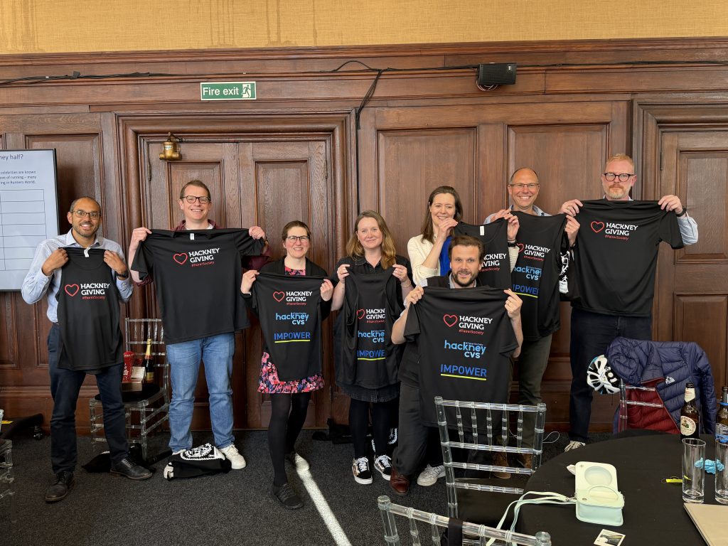 Runners from IMPOWER showing off their Hackney Giving running shirts