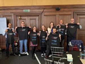Runners from IMPOWER showing off their Hackney Giving running shirts